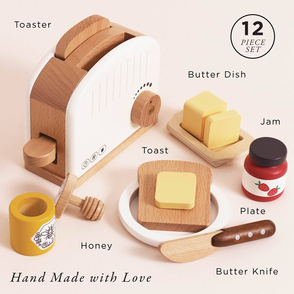 The Pop-up Toaster & Breakfast Set is a 12-piece wooden pretend play set, including a toaster, toast, butter dish, jam jar, honey pot, plate, and butter knife—each "Hand Made with Love" from FSC-certified wood. Ships in one week.