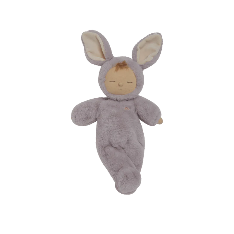 The Olli Ella Cozy Dinkum - Bunny Twinkle is a soft plush doll dressed in a light purple bunny costume with big ears, closed eyes, and a serene expression, resting on a plain white background.