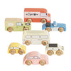 The Vintage Toy Cars set includes seven colorful wooden vehicles such as a van, camper, café truck, and taxi—all with simple designs and wheels labeled "Le Toy Van.