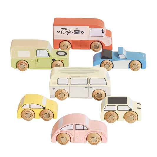 The Vintage Toy Cars set includes seven colorful wooden vehicles such as a van, camper, café truck, and taxi—all with simple designs and wheels labeled "Le Toy Van.