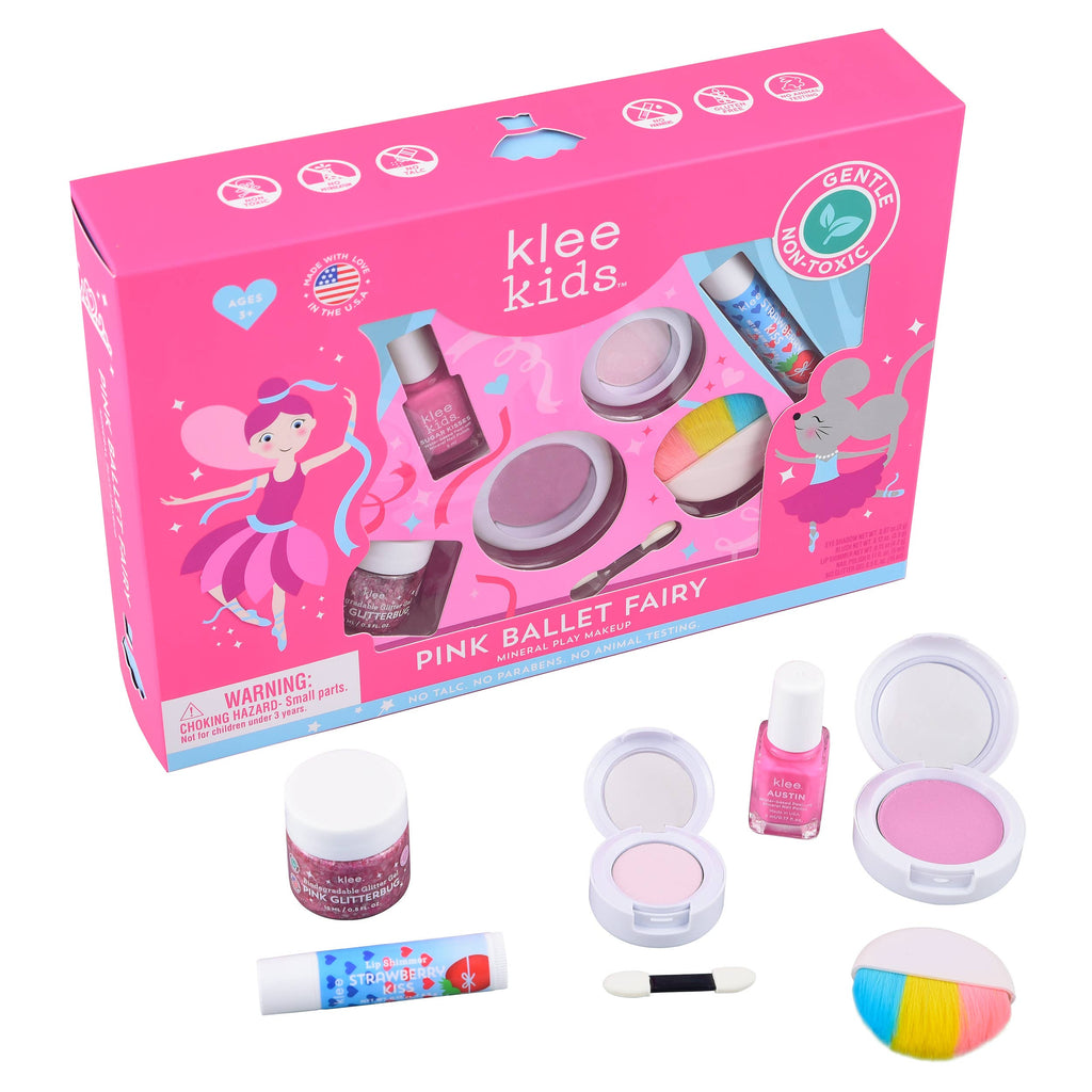 A pink box containing a Klee Naturals Deluxe Makeup Kit - Pink Ballet Fairy, including two round containers of eyeshadow, a nail polish, a lip shimmer tube, and a small applicator brush, with matching items displayed outside the box.