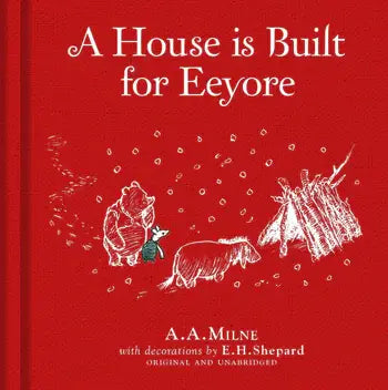 Red book cover titled "Winnie-the-Pooh: A House is Built for Eeyore," a classic picture book by A.A. Milne with E.H. Shepard illustrations. Winnie the Pooh, Piglet, and Eeyore stand near a stick house below the title.
