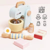 The Bakers Mixer Set & Accessories features pastel wooden pieces—a bowl, rolling pin, milk bottle, egg, and labeled sugar and flour boxes—perfect for pretend play that encourages learning, coordination, imagination, social skills, and dexterity.