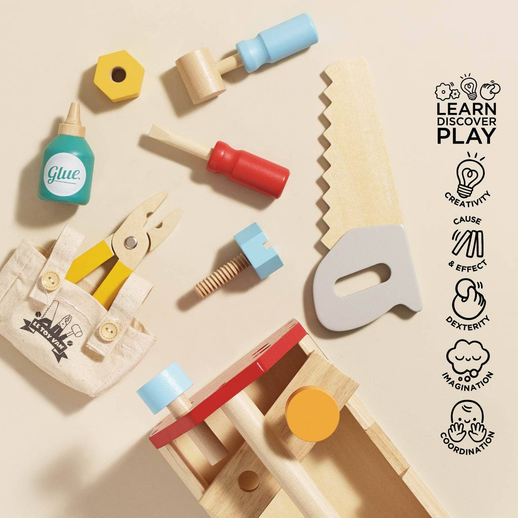 The Tool Box & Wooden Tools set includes a saw, hammer, screwdriver, pliers, and glue bottle, plus a canvas tool belt and workbench. Icons highlight creativity, fine motor skills, imagination, and coordination—ideal for early years play.