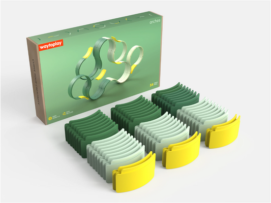 The WaytoPlay: Arches - Builder Set is shown with its box behind three rows of curved plastic track pieces in varying shades of green and yellow, neatly arranged on a white surface—this creative construction toy encourages imaginative play and offers endless building possibilities for children.