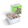 A Cuboro Junior Marble Run Starter Set featuring a partially opened box displaying various wooden building blocks, placed next to its packaging box with an image of a constructed marble run.
