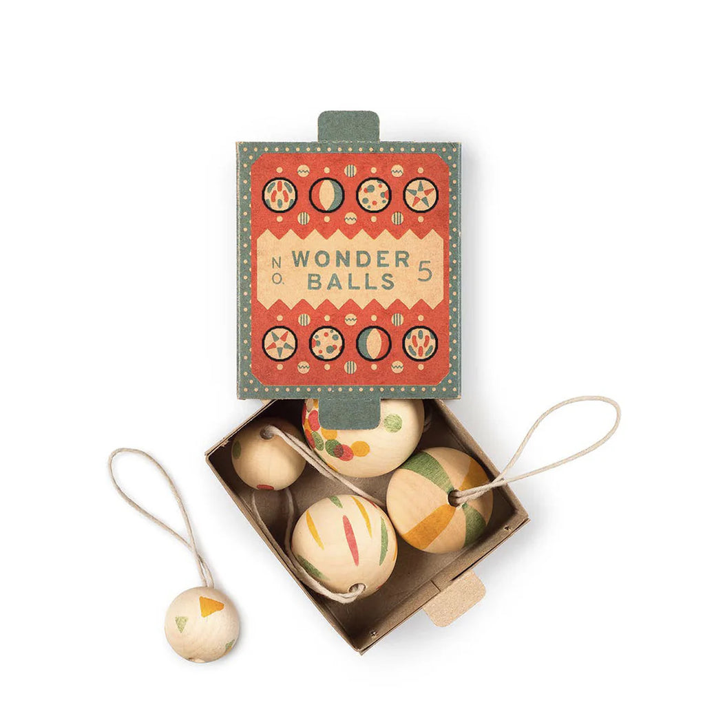 The Grapat Ornament Set - Wonder Balls features a vintage-style box containing five colorful, patterned hand-painted wooden ornaments with string loops, perfect for adding unique holiday charm to your decor.