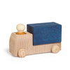 The Lubulona Wooden Truck - Blue features a natural wood cab and wheels, a round wooden driver, and a blue rectangular bed—ideal for eco-friendly toy lovers.