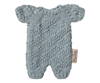 The Maileg Extra Clothing: Knitted Suit, Micro - Blue for Micro Bunny is a light blue, short-sleeved, textured romper with a fabric tag, shown flat on a white background—perfect for dressing up your micro bunny.