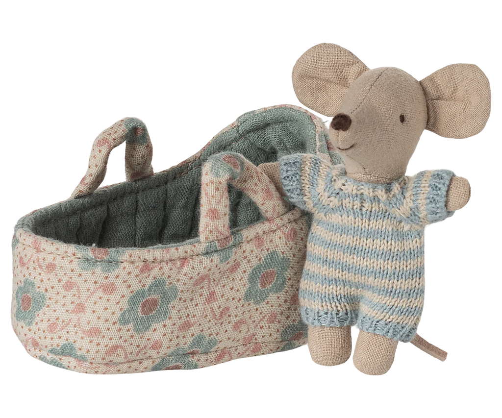 The PRE-ORDER: Baby Mouse in Carry Cot - Blue (Estimated Ship Date: Late October) features a tiny mouse in a blue and white knitted outfit standing by a floral quilted carry cot with handles and a green interior.