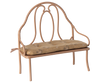 The PRE-ORDER: Vintage Bench, Mini - Dark Powder features a dark powder metal frame, cushioned floral-patterned seat, and ornate curved backrest. Ideal for bunny or rabbit companions or as a decorative accent. Ships early October.