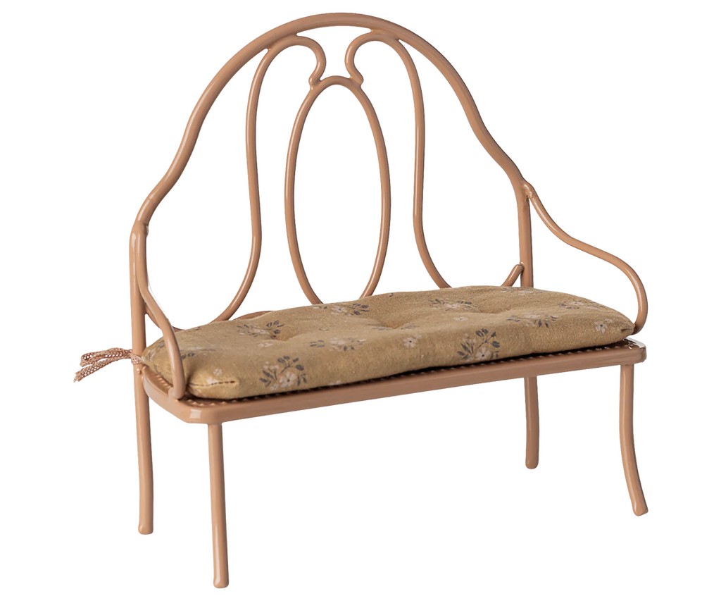 The PRE-ORDER: Vintage Bench, Mini - Dark Powder features a dark powder metal frame, cushioned floral-patterned seat, and ornate curved backrest. Ideal for bunny or rabbit companions or as a decorative accent. Ships early October.