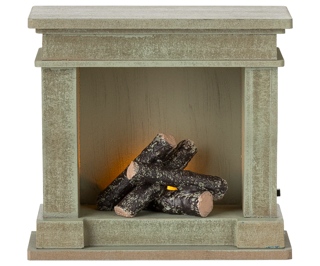 Inspired by the PRE-ORDER: Fireplace, Miniature - Dusty Green (ships early October), this artificial fireplace features decorative logs and a soft amber light—perfect for adding charm to your miniature home display.