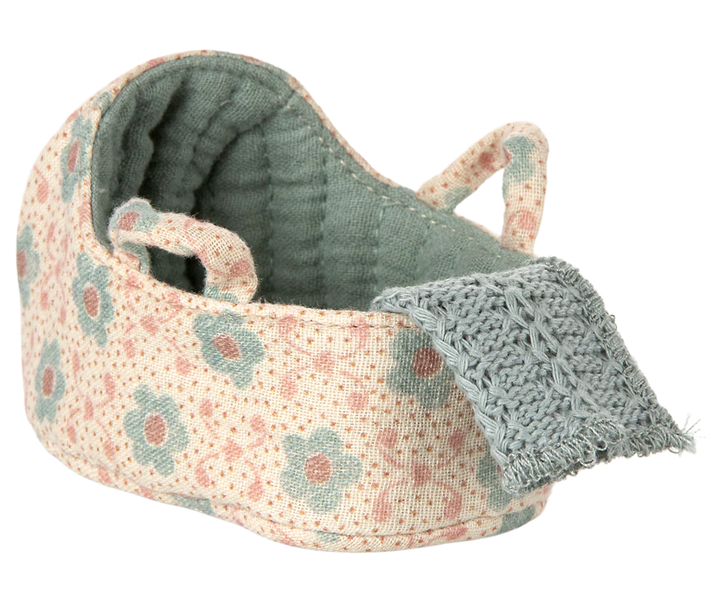 The PRE-ORDER: Carry Cot, Baby Mouse Size - Blue is a small fabric cot with a soft interior, two handles, and a gray knitted flap. Designed for baby mice, it’s portable and cozy. Estimated ship date: late November.