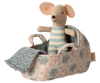 The PRE-ORDER: Carry Cot, Baby Mouse Size - Blue (ships late November) features a small stuffed mouse in blue-and-white stripes, nestled in a floral-patterned cot with a blue knitted blanket—a charming sleep solution for baby mice.