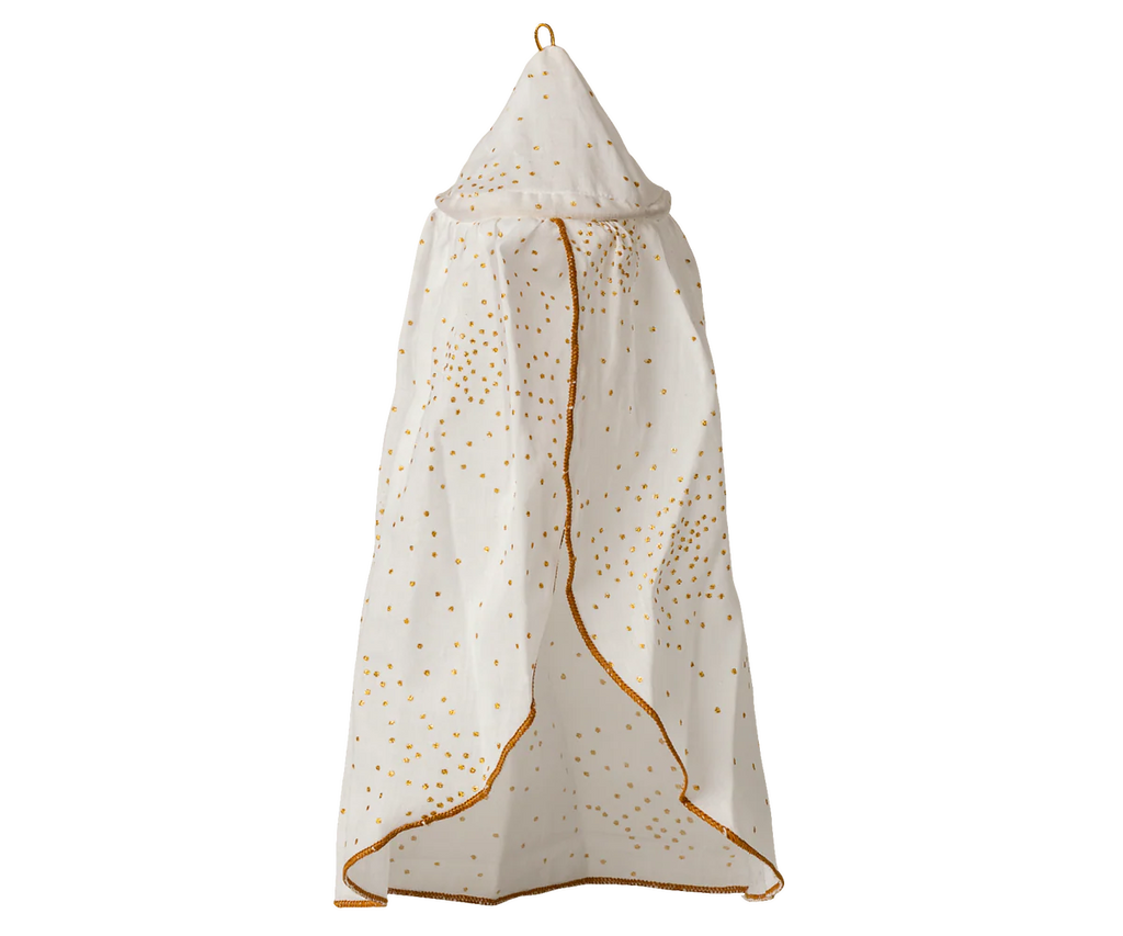 The Maileg Bed Canopy, Miniature - Off-White, features a pointed top with gold dot decorations and gold trim. Hanging from a loop, it adds romantic charm to any bed décor.