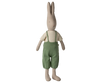 The Maileg Rabbit, Size 5 - Classic, wears a knitted shirt and overalls, and stands upright against a plain white background. Expected arrival: 02/15/26.