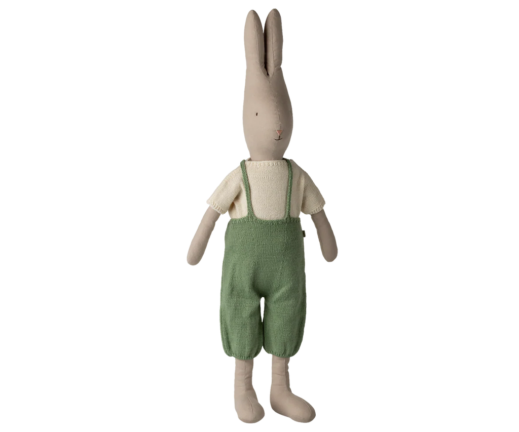 The Maileg Rabbit, Size 5 - Classic, wears a knitted shirt and overalls, and stands upright against a plain white background. Expected arrival: 02/15/26.