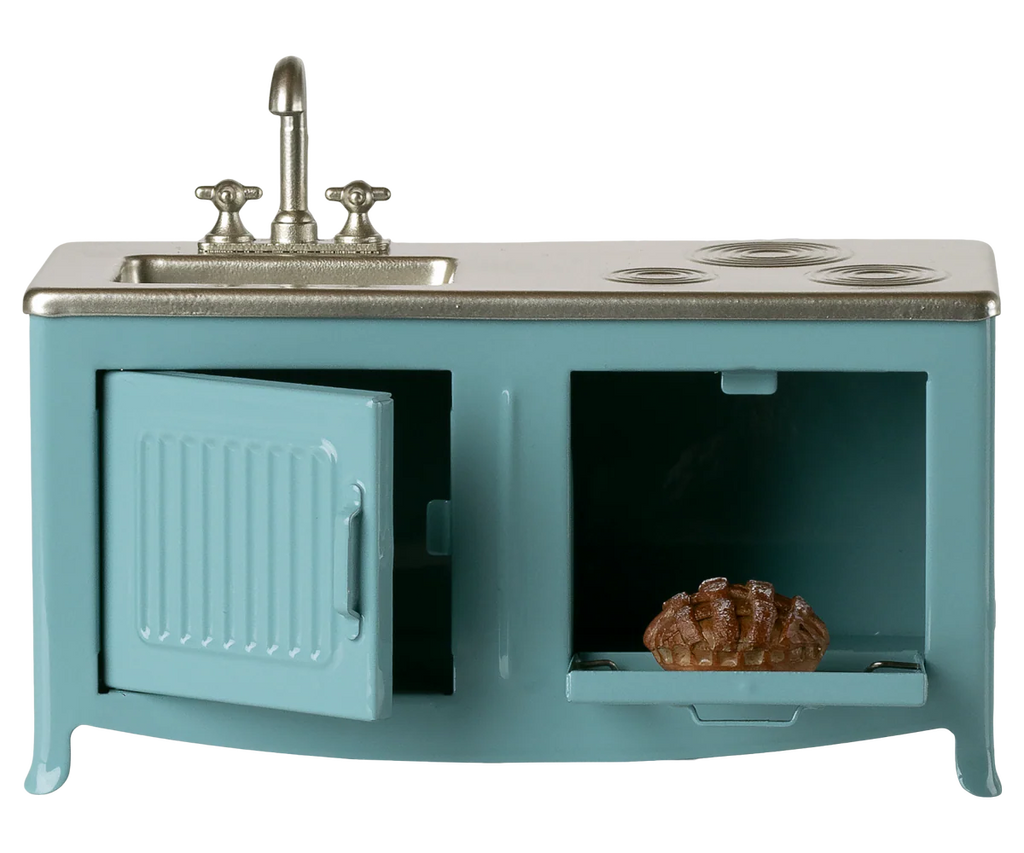 The Maileg Kitchen, Mouse - Blue is a miniature metal set with a sink, stove, open oven doors, and a tiny pie on a pull-out tray—perfect for any mouse family’s cozy toy kitchen.