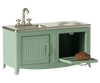 The Maileg Kitchen, Mouse - Mint (arriving 02/15/26) is a small mint green metal playset with a sink, faucet, stovetop, oven, and mini loaf of bread—ideal for imaginative mouse family cooking adventures.