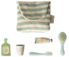 The Maileg Toothbrush Set in Bag, Mouse - Blue Stripe (arriving 04/15/26) includes a small green and white striped pouch with five mini toiletry essentials: shampoo, cup, toothpaste, blue toothbrush, and hairbrush.