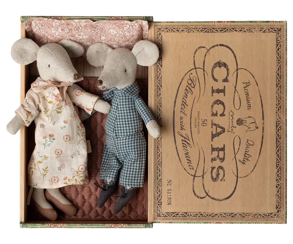 Maileg Grandma and Grandpa Mice in Cigarbox (expected 03/01/26) snuggle together in a cozy bed with quilted bedding and vintage-style details—an adorable scene perfect for collectors or imaginative play.