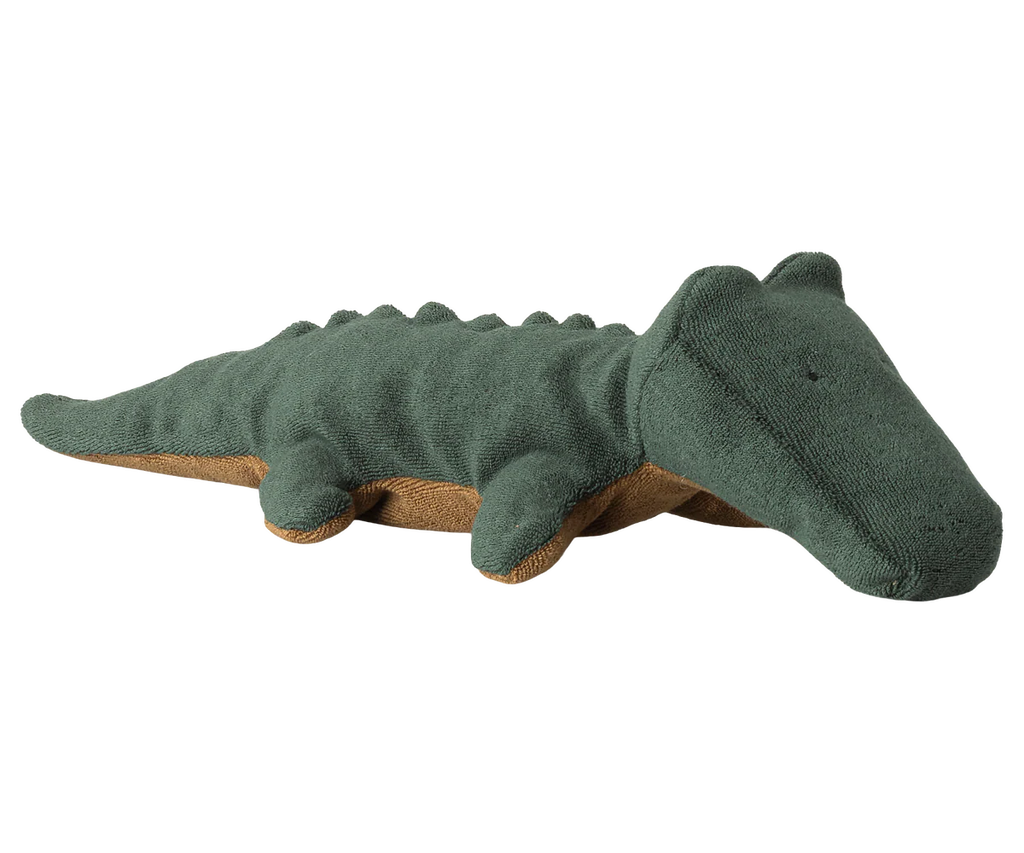 The Maileg Crocodile, Small - Forest Green is a huggable plush toy with a brown underside, textured fabric, small legs, and embroidered eyes. Shaped like a green crocodile, this stuffed animal is expected to arrive by 06/15/26.