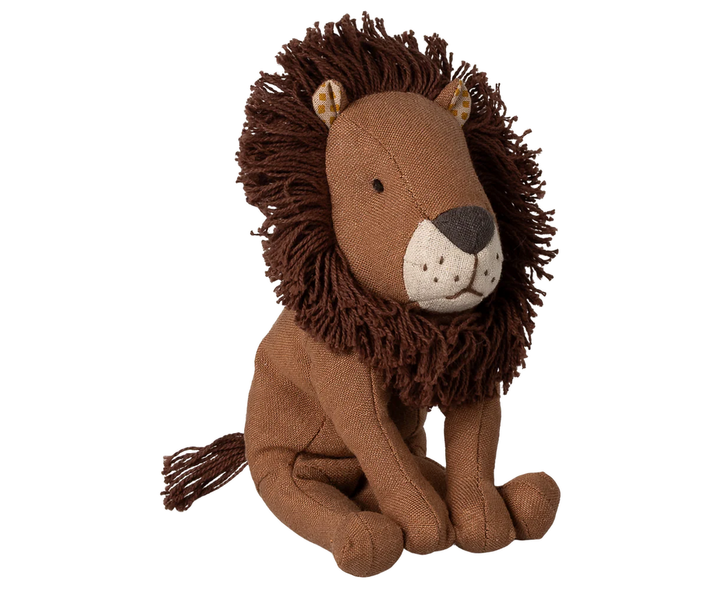 Maileg Little Leo the Lion is a small plush with a brown mane, beige face, stitched features, floppy legs, and a visible tail. This adorable stuffed animal sits upright against a plain white background.