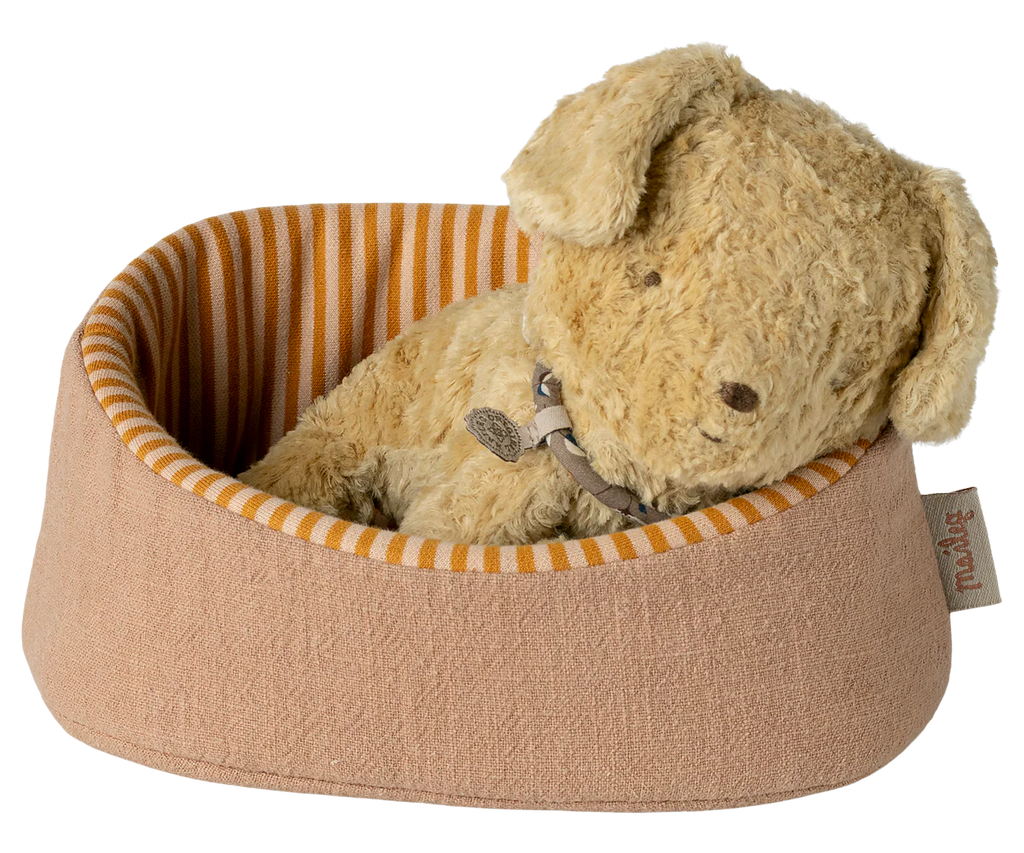 The Maileg Pet Basket - Powder (expected 03/01/26) features a pinkish-brown exterior and orange striped interior, providing a cozy spot for Maileg puppies or any tiny friend seeking comfort.