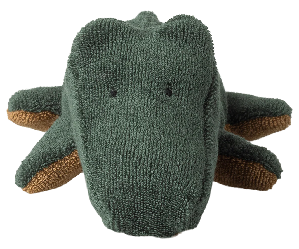 The Maileg Crocodile, Mini - Forest Green is a huggable plush toy shaped like a crocodile, with small black stitched eyes and brown leg accents. Expected arrival: 06/15/26.