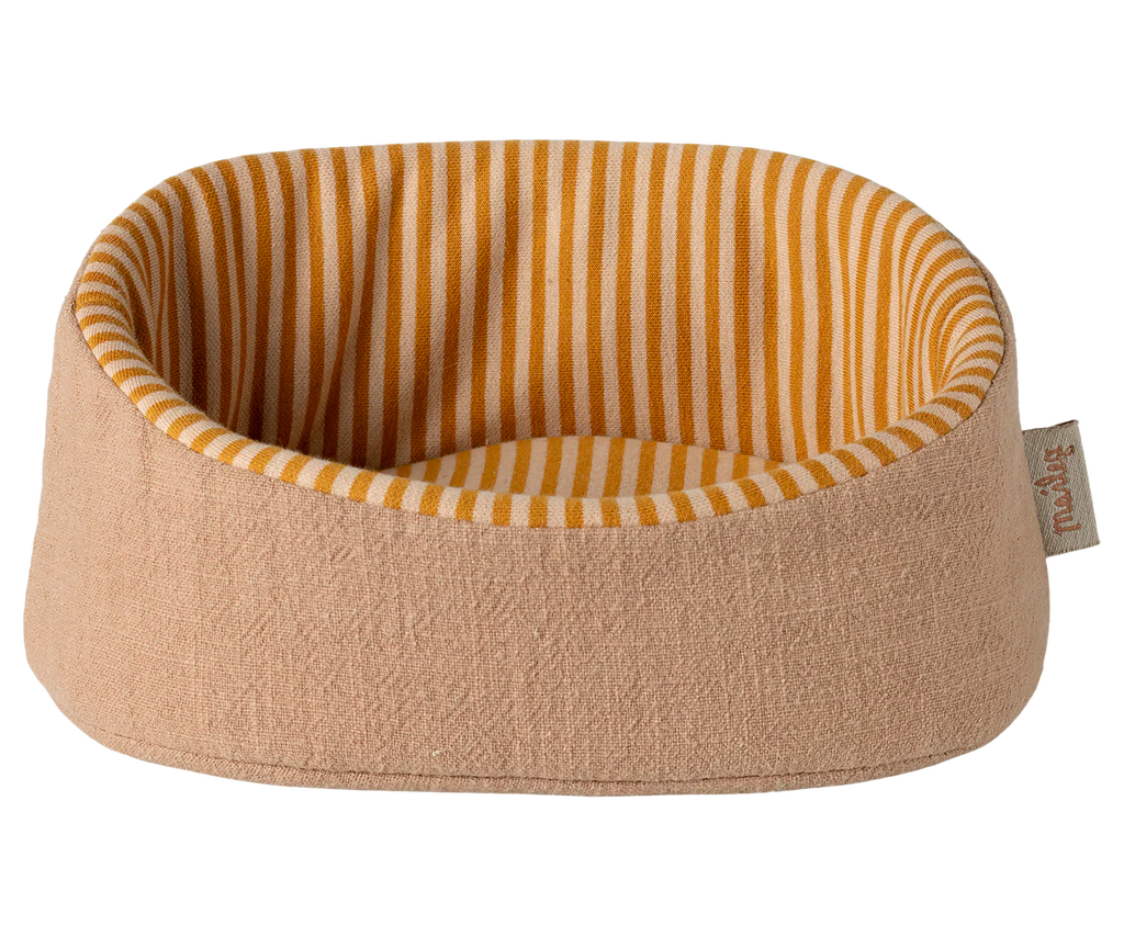 The Maileg Pet Basket - Powder features a soft, light brown exterior and an orange-and-white striped interior—ideal for Maileg puppies and perfect as a cozy pet bed. (Expected arrival: 03/01/26).