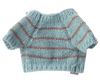 Pre-order the Maileg Knitted Puppy Sweater in Dusty Blue (arriving by 04/15/26)—a small, soft and charming accessory with brown stripes, perfect for your puppy or their favorite stuffed animal.