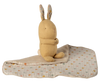 The Maileg Lullaby Friends Bunny Mini in cream yellow, with long polka-dotted ears, sits upright on a matching dotted blanket—an ideal newborn gift combining softness and cozy style. Expected arrival: 04/15/26.