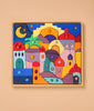 Grimm's Sparkling Mandala Orient is a vibrant wooden puzzle featuring a whimsical cityscape adorned with arches, domes, and star motifs. Embedded gem-like pieces add intricate beauty reminiscent of sparkling mandalas. Set in a light wooden frame against a beige background, this puzzle is designed to inspire imaginative play.