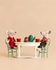 Maileg Christmas Mice Set twins sit at a vintage dining table with a teapot, cups, and a dessert.
