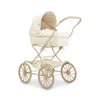 The Konges Sloejd Doll Pram - Lemon features a cream quilted fabric with subtle patterns, a curved handle, large spoked wheels on a beige frame, and includes an organic cotton mattress for extra comfort.