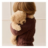 A young child in a textured brown sweater cuddles Snuggle Bunnies - Arthur the Bear, their faces nestled together in its ultra-soft plush.