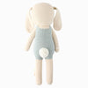 The Cuddle + Kind Henry the Bunny is a hand-knit plush bunny made from 100% cotton yarn, featuring floppy ears, a light blue outfit, and a small white tail, shown from the back against a plain white background.