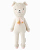 Cuddle + Kind Lola the Llama is a soft, hand-knit cream-colored doll featuring pink cheeks, tassels, and pink details on its ears, hands, and feet—a delightful fair trade toy for all ages.