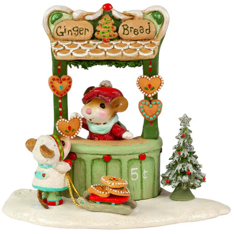 The Wee Forest Folk Tiny Collectible - A Gingerbread Christmas features a festive mouse in a red hat selling cookies from a “Ginger Bread” stand to another mouse with a cookie sled, plus a snowy tree for holiday charm.