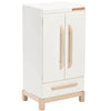 The Milton & Goose Essential Play Refrigerator is a white wooden cabinet with two doors, light wood handles and legs, a lower drawer, minimalist design, and a small brand label—perfect for play kitchens or imaginative play. Made in the USA.