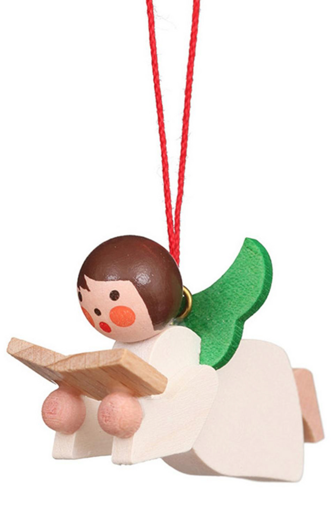 The Christian Ulbricht Ornament - Angel showcases a wooden design with green wings, rosy cheeks, and a red string. It holds a small book, combining simplicity with colorful details to capture a whimsical charm.
