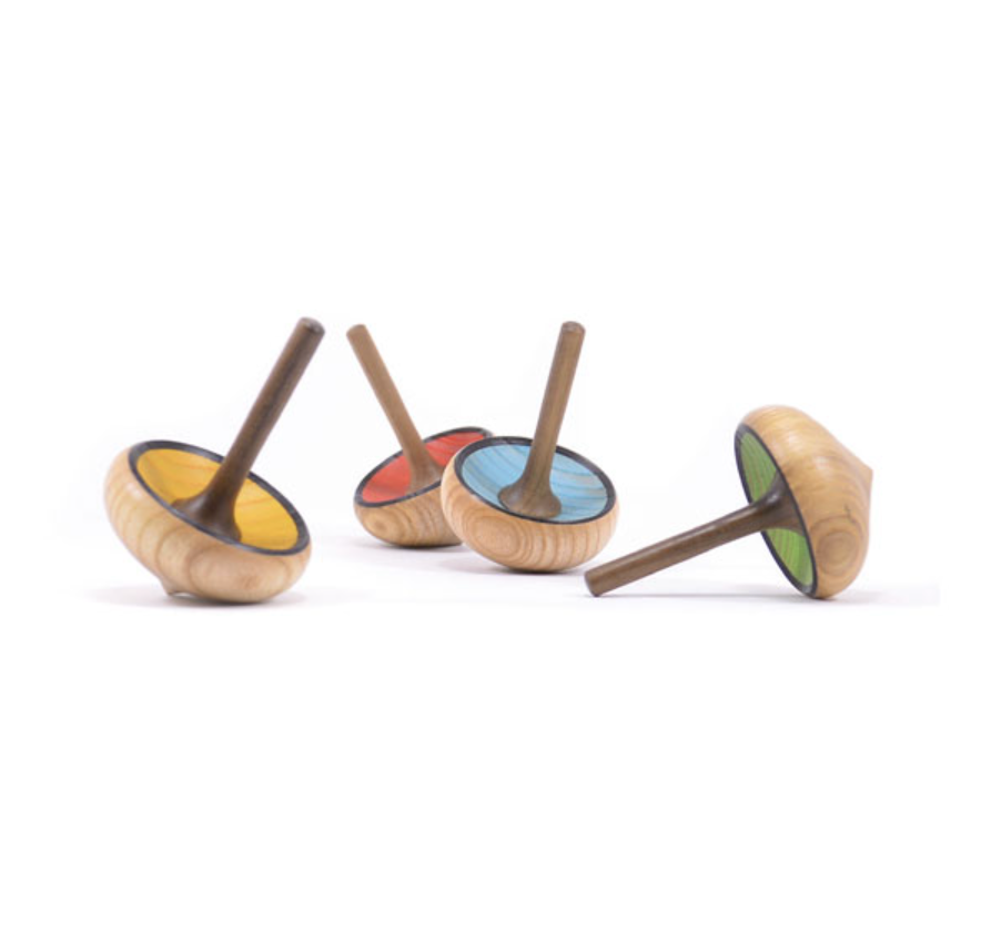 The Mader Zwirbel Spinning Top - Red is shown lying on its side on a white background, crafted from walnut and ash wood, and made to strict toy safety standards.