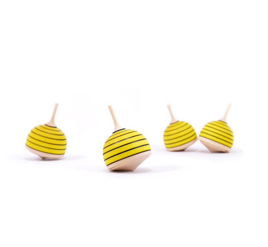 Four Spinning Top - Bumble Bee toys, crafted from Maple wood and featuring yellow and black stripes, are arranged on a white background at different angles to showcase their unique designs and compliance with safety standards.