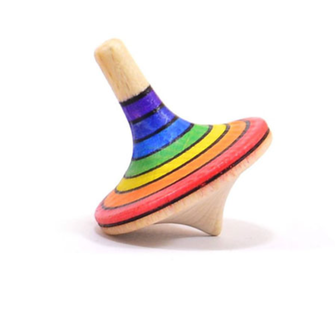 The Mader Large Spinning Top - Rainbow, crafted from beech wood and adorned with vibrant rainbow stripes, rests at an angle on a white background.