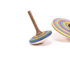 Two Mader Small Spinning Tops - Striped, one upright and one on its side, rest on a white background. Each top features concentric rainbow-colored stripes and a brown handle inspired by classic designs.