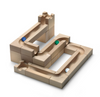 The Cuboro Wave Marble Run Extra Set features smooth natural wood blocks with interconnected tracks and includes three marbles—blue, green, and white—placed on various sections of the creative marble run structure.