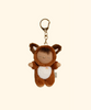 The Olli Ella Cozy Bag Charm - Fox Finnley features a small, brown plush doll in a fox costume with closed eyes and a rainbow on its white belly. This adorable keychain comes with a gold clasp and is perfect for accessorizing bags.