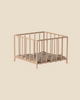 The Maileg Nursery Set features a small, square playpen with pale pink bars and a patterned blanket, shown on a plain beige background.