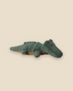 Pre-order the Maileg Crocodile, Mini - Forest Green! This huggable plush toy features a textured surface, stubby legs, and small bumps along its back. Expected arrival: 06/15/26.
